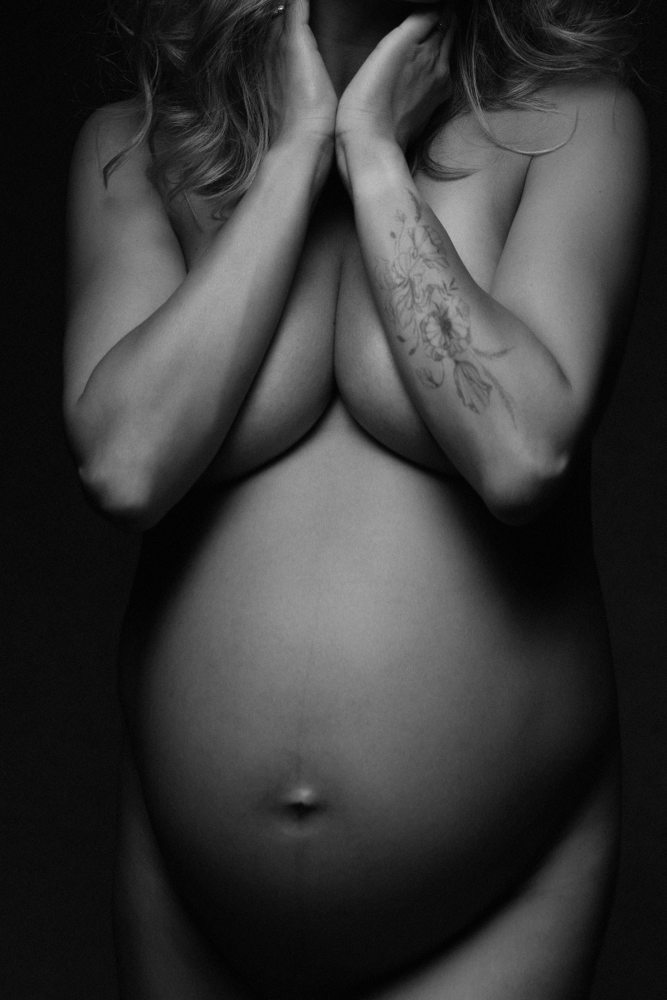 Fine art black styling pregnancy portrait